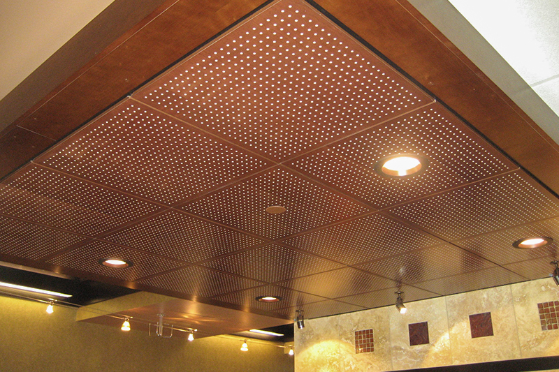 Wood accoustical ceiling tiles installed in the reception area of a bank