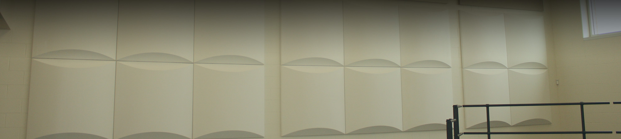 Sound panels installed on the walls of a school choir room to provide sound absorbtion and improved accoustics